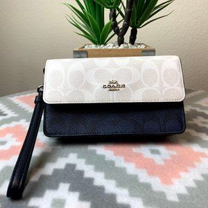 FOLDOVER WRISTLET IN BLOCKED SIGNATURE CANVAS